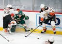 Ducks defenseman Josh Manson (42) got a piece Wild left wing Kevin Fiala (22) while attempting to check him in the third period, leaving the loose puc