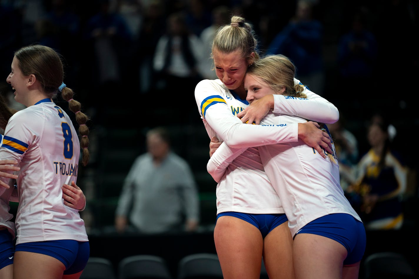 Wayzata High School outside hitter Avery Jesewitz (17) and outside hitter Kate Dimler (15) hug after the team's winning point against New Prague High School at the 4A volleyball match at Xcel Energy center in St. Paul Minn. on Saturday, Nov. 11, 2023. This match finalized Wayzata as an undefeated team this season. ] Angelina Katsanis • angelina.katsanis@startribune.com