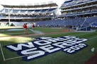 Groundskeepers prepare the infield for batting practice at Nationals Park in Washington, Thursday, Oct. 24, 2019. The Houston Astros and Washington Na