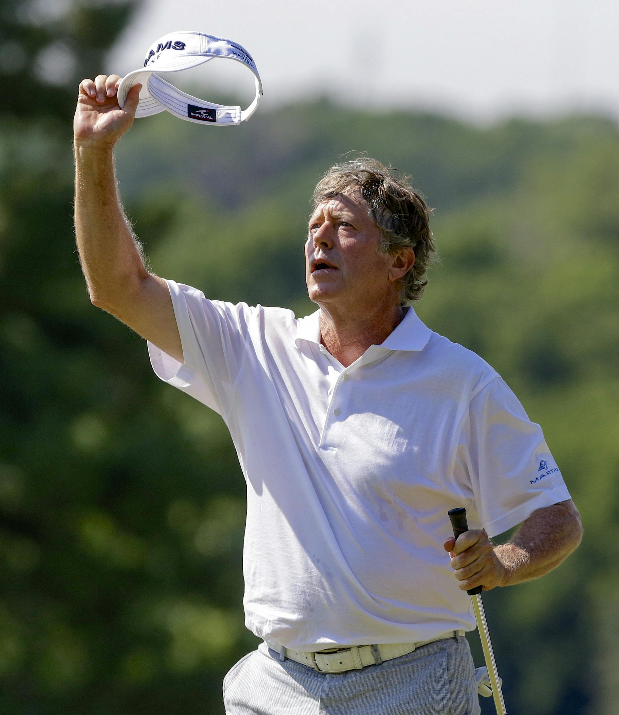 Michael Allen waves to the gallery on the 18th hole green Sunday, July 14, 2013, in the final round of the U.S. Senior Open golf tournament in Omaha, Neb. (AP Photo/Nati Harnik) ORG XMIT: MIN2013072701093414