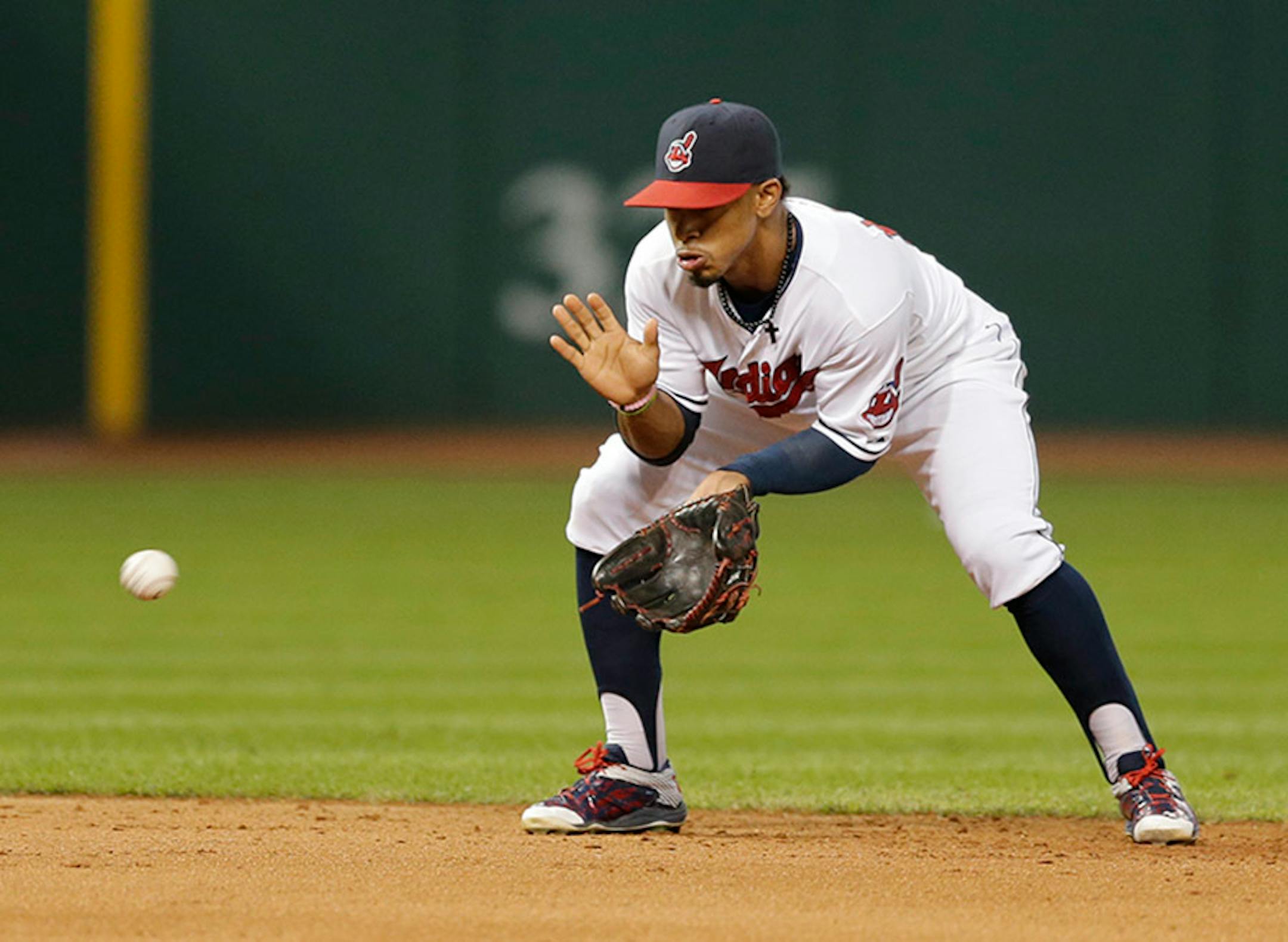 Cleveland Indiansí Francisco Lindor fields a ball hit by Minnesota Twins' Brian Dozier in the sixth inning of a baseball game, Thursday, Oct. 1, 2015, in Cleveland. Dozier was out on the play. (AP Photo/Tony Dejak)