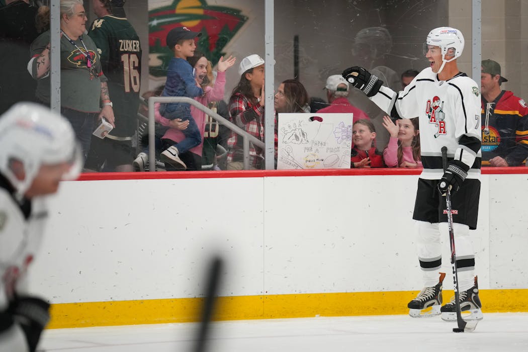 Joe Mauer waved to his kids during warmups for the “Crazy Game of Hockey” charity game in St. Paul earlier this month.