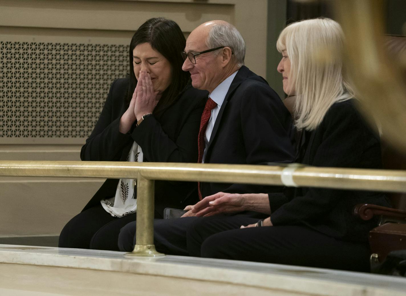 Jenny Teeson, with her parents Jerry and Terry Teeson, reacted to the unanimous House vote on the bill to outlaw marital rape.