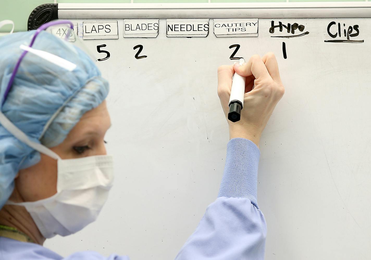 Brenda Hall, circulator of the ER, counted equipment to be used in a surgery at the University of Minnesota Medical Center, Wednesday, February 15, 2015 in Minneapolis, MN. Eleven years of publicly reporting hospital foul-ups has reduced the number of incidents in which sponges and instruments are left inside patients in surgery. The increasingly complex technology and the rise in minimally invasive surgery has created a new problem: fragments of wires and devices left inside patients. ] (ELIZAB