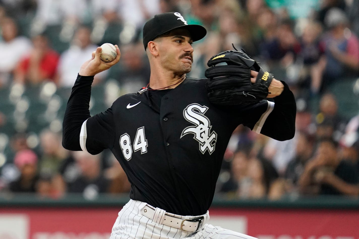 Chicago White Sox starting pitcher Dylan Cease throws against the Twins during the first inning Saturday