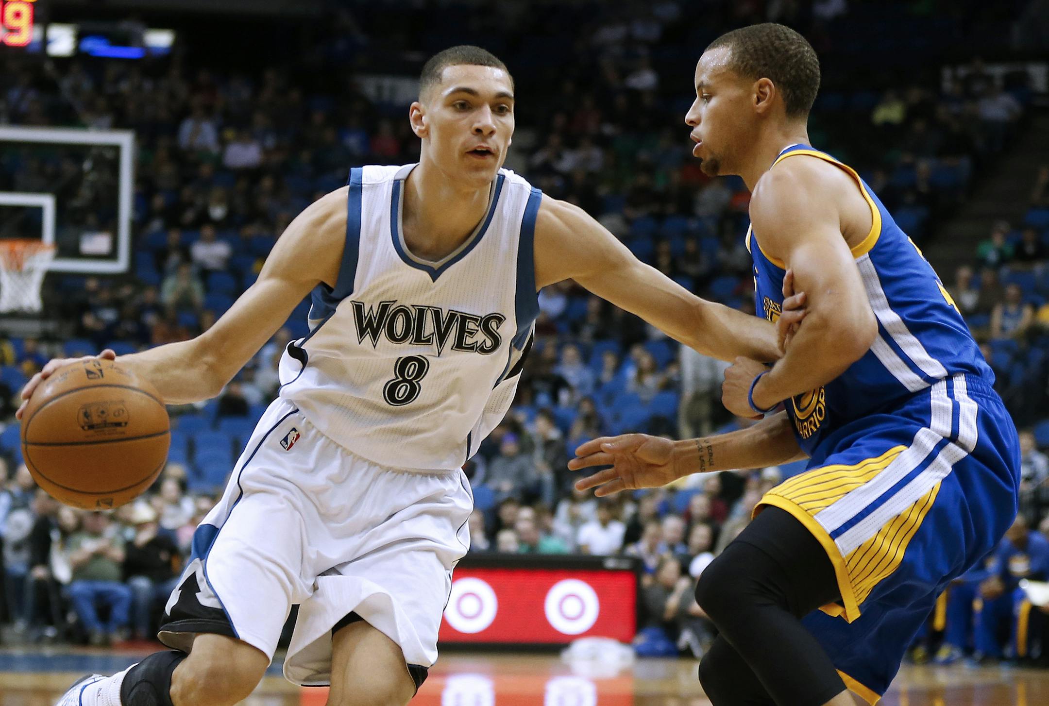 Wolves guard Zach LaVine pushed the ball down the court past Warriors guard Stephen Curry during the first half of Golden State's 102-86 victory at Target Center on Monday.
