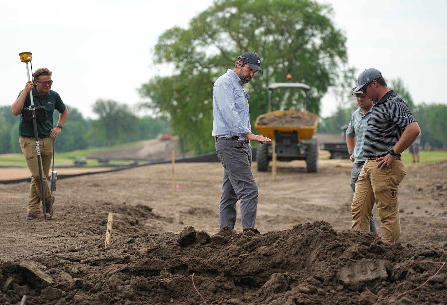 Golf architect Andrew Green (Center) likes to be hands on in the dirt. Interlachen is preparing for the 2030 U.S. Women's Open. Maybe the most historic of all Minnesota courses is shutting down for a year for a complete course renovation being done by nationally renowned Andrew Green, golf architect. He did the acclaimed Oak Hill renovation that is getting big press during this week's PGA Championship. Andrew will be in town for one of his periodic visits on the project.Friday, June 2, 2023 Minneapolis, Minn. ] Brian Peterson ¥ brian.peterson@startribune.com