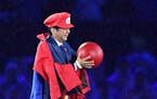 Japanese Prime Minister Shinzo Abe appears as the Nintendo game character Super Mario during the closing ceremony at the 2016 Summer Olympics in Rio d