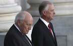 Former Vice President Dick Cheney, left, and and former Vice President Dan Quayle, await the arrival of the procession carrying the casket of former P