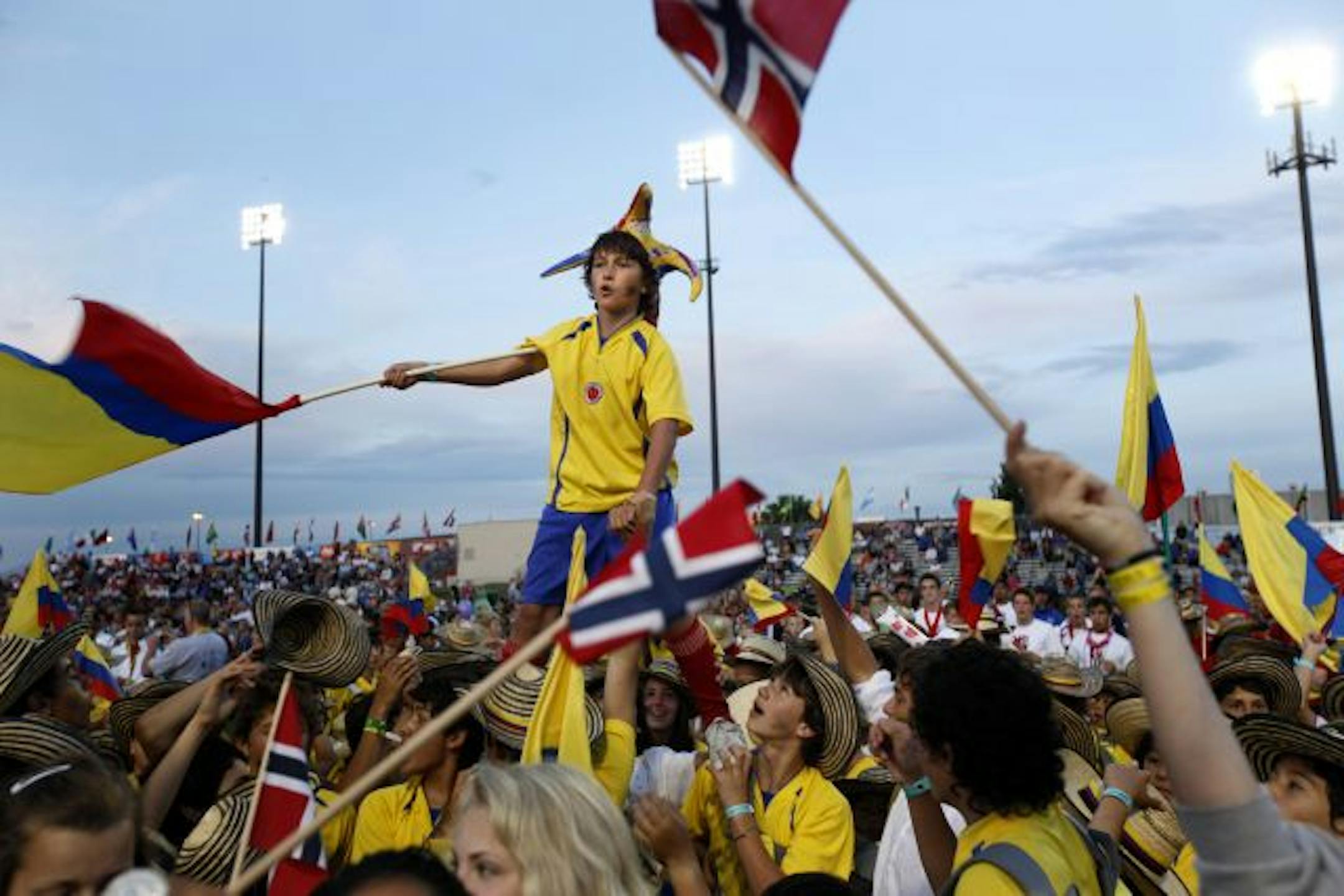 Salvador Pombu, 10, waved the Colombian flag while being held up by teammates in a sea of color and soccer players during opening ceremonies of the Schwan's USA Cup tournament in Blaine on Tuesday.