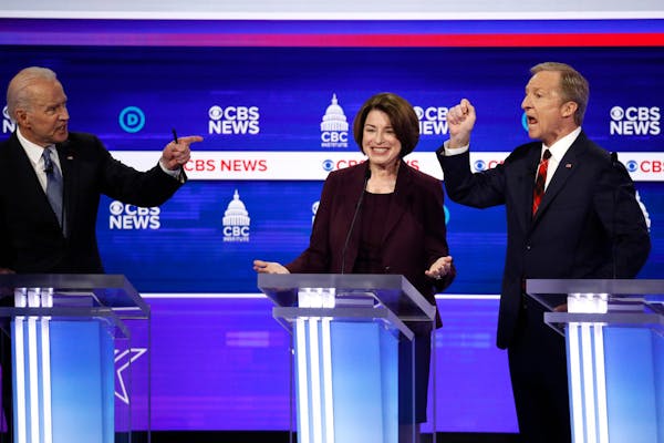 Amy Klobuchar, center, has showed no signs of dropping out as the Democratic presidential race focused on South Carolina.