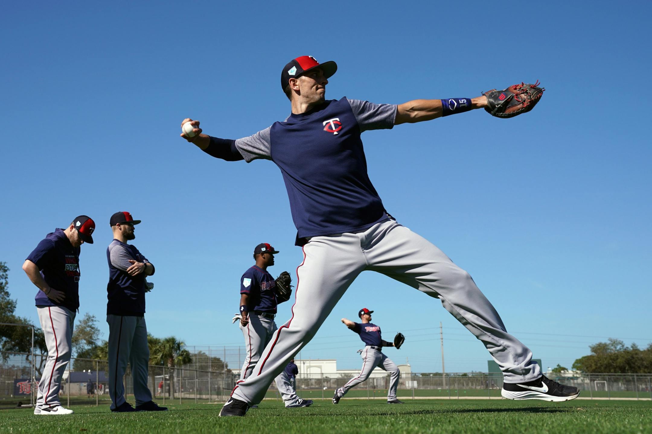 Twins catcher Jason Castro (15) played catch with fellow catcher Mitch Garver (18) Thursday morning.