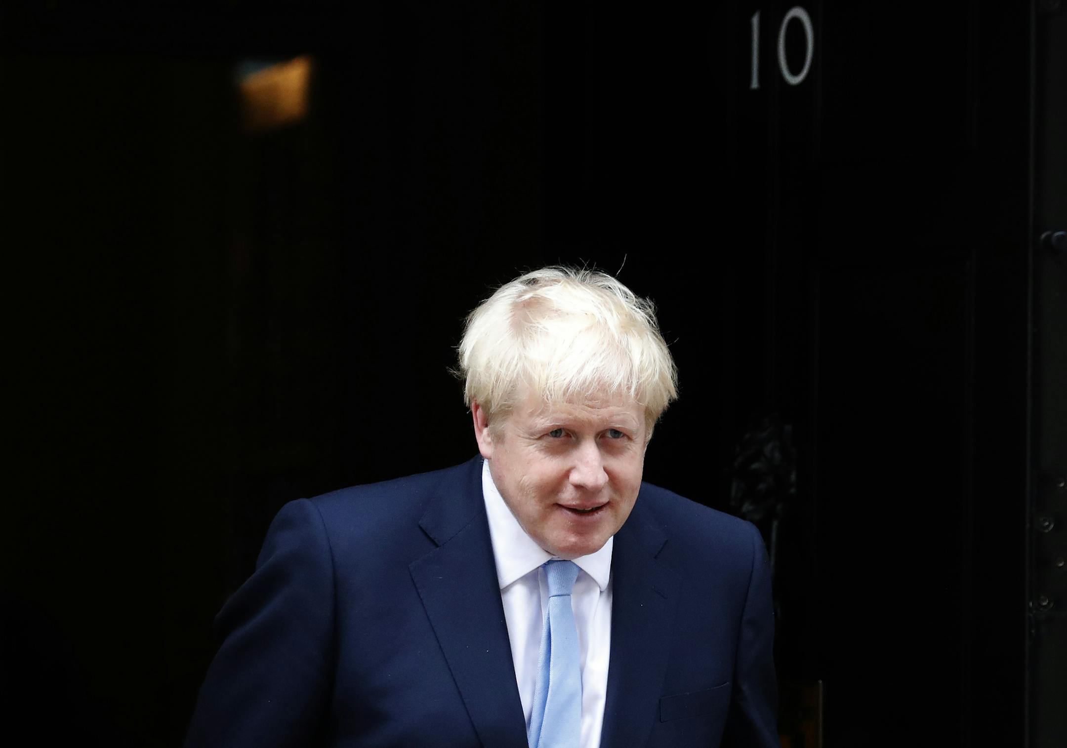 Britain's Prime Minister Boris Johnson leaves the door to welcome King Abdullah II of Jordan at 10 Downing Street in London, Wednesday, Aug. 7, 2019. Johnson holds bilateral talks and a working lunch with the King of Jordan. (AP Photo/Frank Augstein) ORG XMIT: FAS101