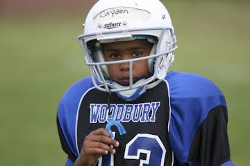 Cayden McCorkel, 9 waited for instructions during practice for the Woodbury Royals in Woodbury Min., Wednesday August 15, 2012. Last year McCorkel suf