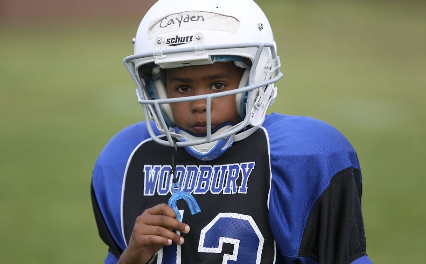 Cayden McCorkel, 9 waited for instructions during practice for the Woodbury Royals in Woodbury Min., Wednesday August 15, 2012. Last year McCorkel suffered a concussion that kept him out of school for a week.