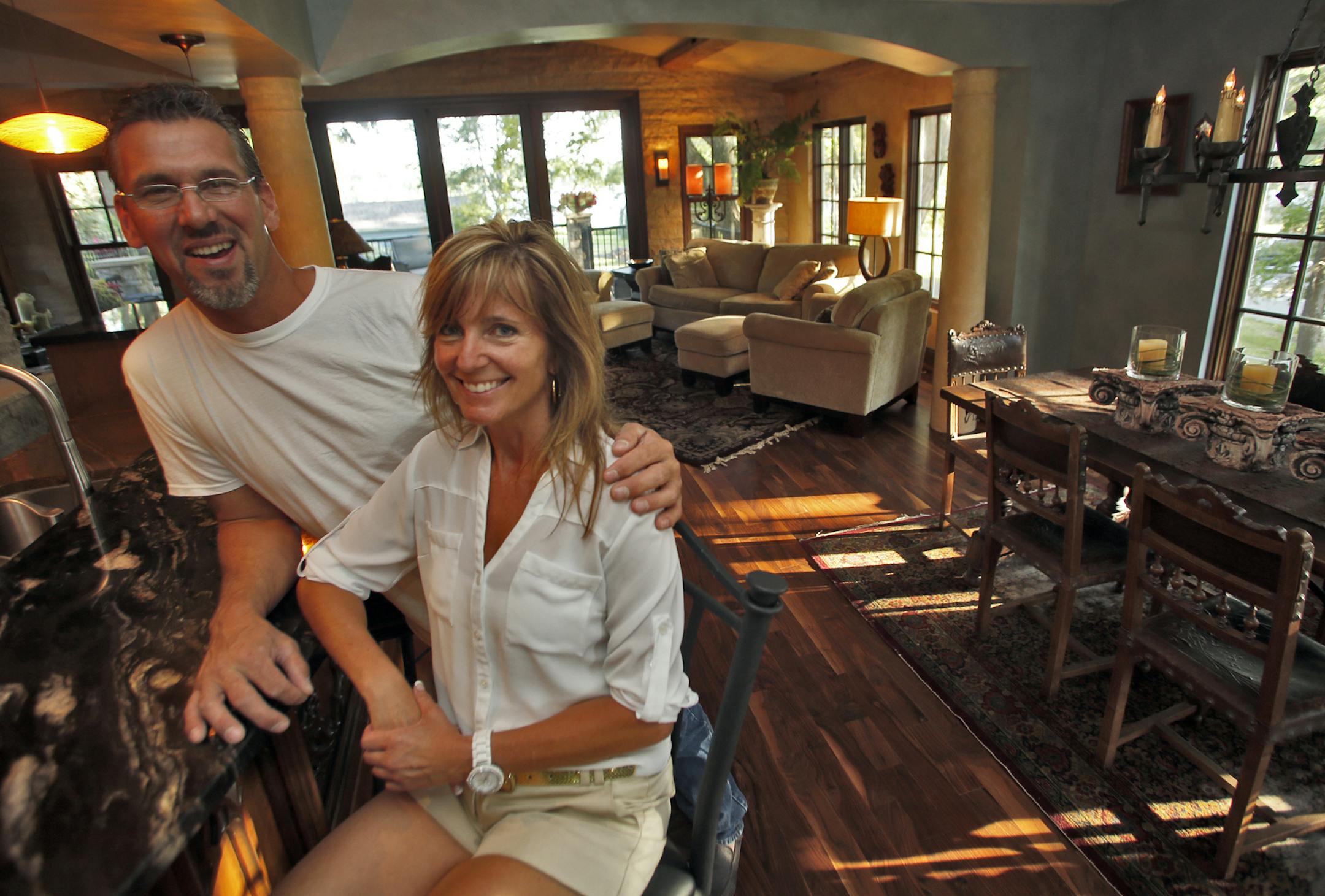 A look at the remodeled home of Jeff McCloskey in Mendota Heights. Jeff McCloskey, left, and friend Barbara Rose in the great room with dining area at right. (MARLIN LEVISON/STARTRIBUNE(mlevison@startribune.com