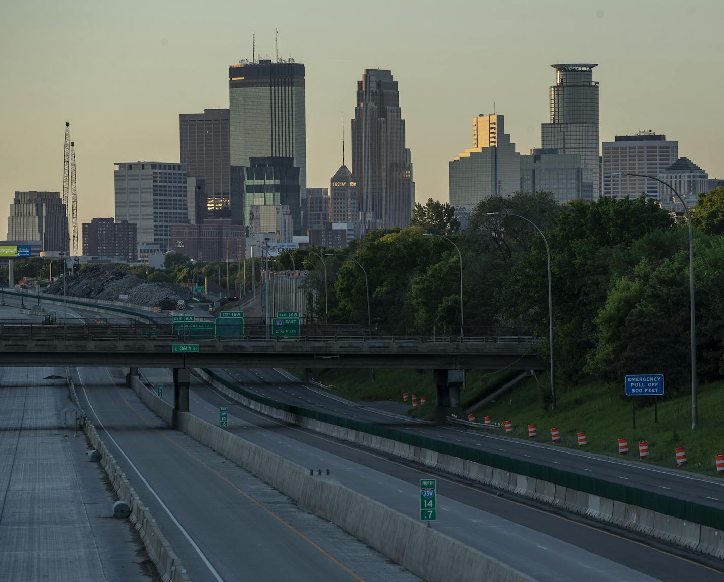 Dusk in Minneapolis after city wide curfew imposed. ] CARLOS GONZALEZ • cgonzalez@startribune.com – Minneapolis, MN – May 30, 2020, Police Protest - man died after a confrontation with Minneapolis on Monday evening. A bystander video that started circulating sometime after the incident appeared to show the man pleading with officers that he couldn't breathe - George Floyd