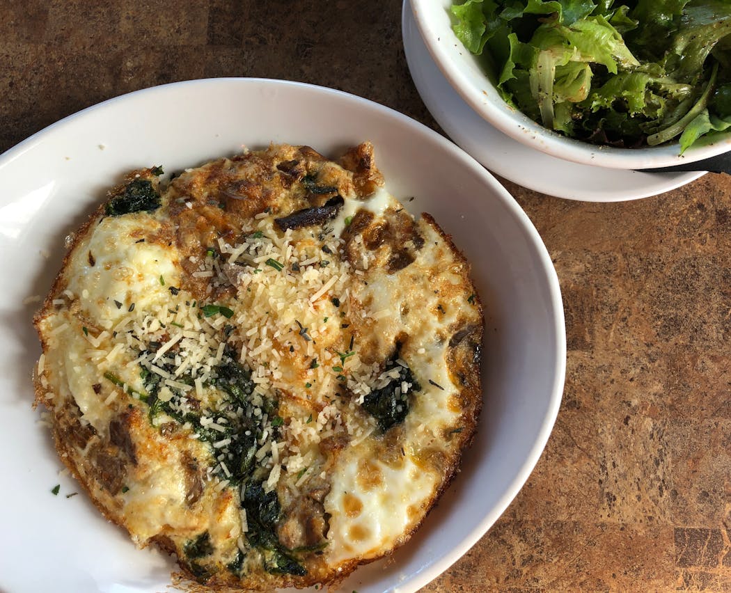 The Wild Mushroom Frittata is served with a snappy tossed salad at The Hen & The Hog.