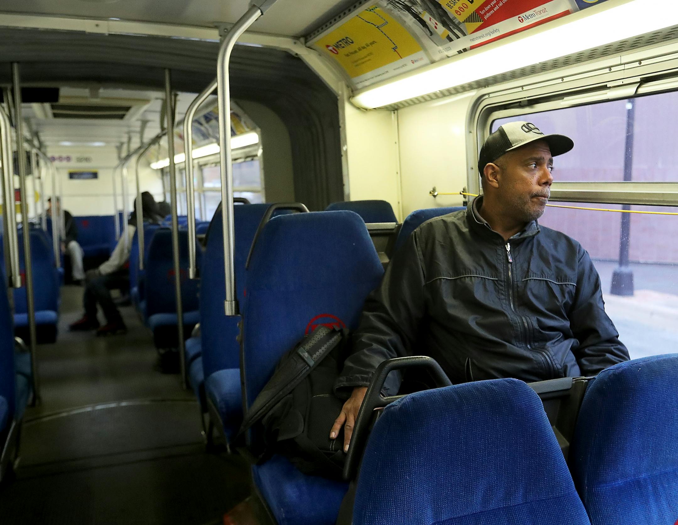 After moving out of the Higher Ground homeless shelter in Minneapolis Douglas Pyle, 49, rides on a city bus to his hotel room for the first time Friday, May 1, 2020, in Minneapolis, MN. Pyle, whose life's possessions fit into his backpack, is among more than 400 homeless people in Hennepin County who have been relocated to area hotels since the pandemic began. Pyle grew up in Indiana, spent a number of years in Florida and Madison, WI, before coming to Minneapolis 13 years ago and becoming homel