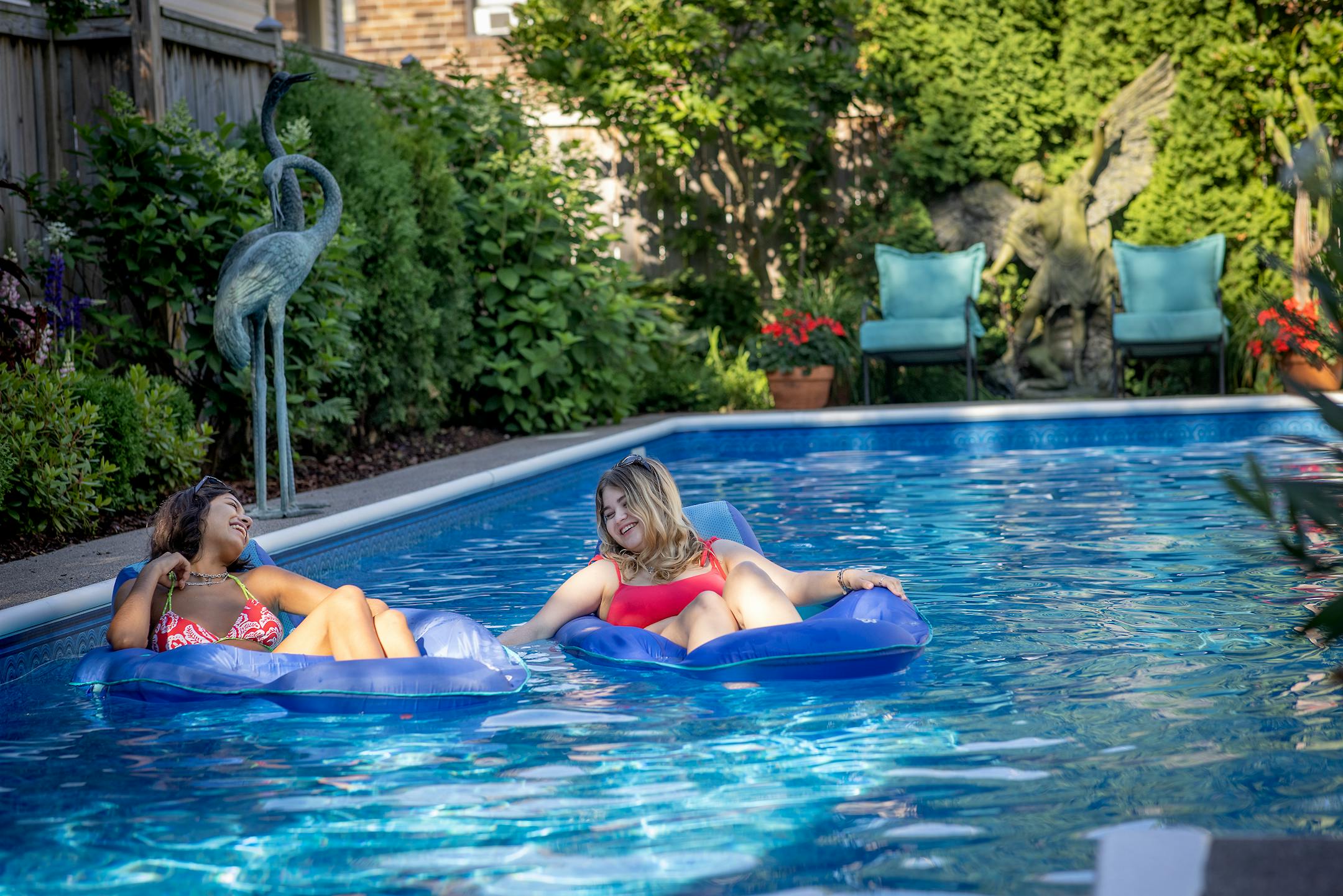 Valeria Martinez-Rojas, left, and Sloan Carden enjoyed a morning swim at the home of Sean Ryan and Ed Piechowski, Wednesday, June 30, 2021 in St. Paul, MN. ] ELIZABETH FLORES • liz.flores@startribune.com
