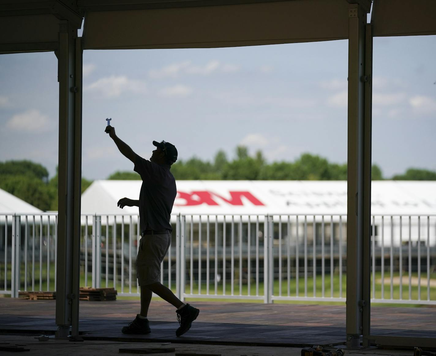 Alan Matty assembled a tent near the 18th hole at TPT Twin Cities in Blaine before the 3M Open.