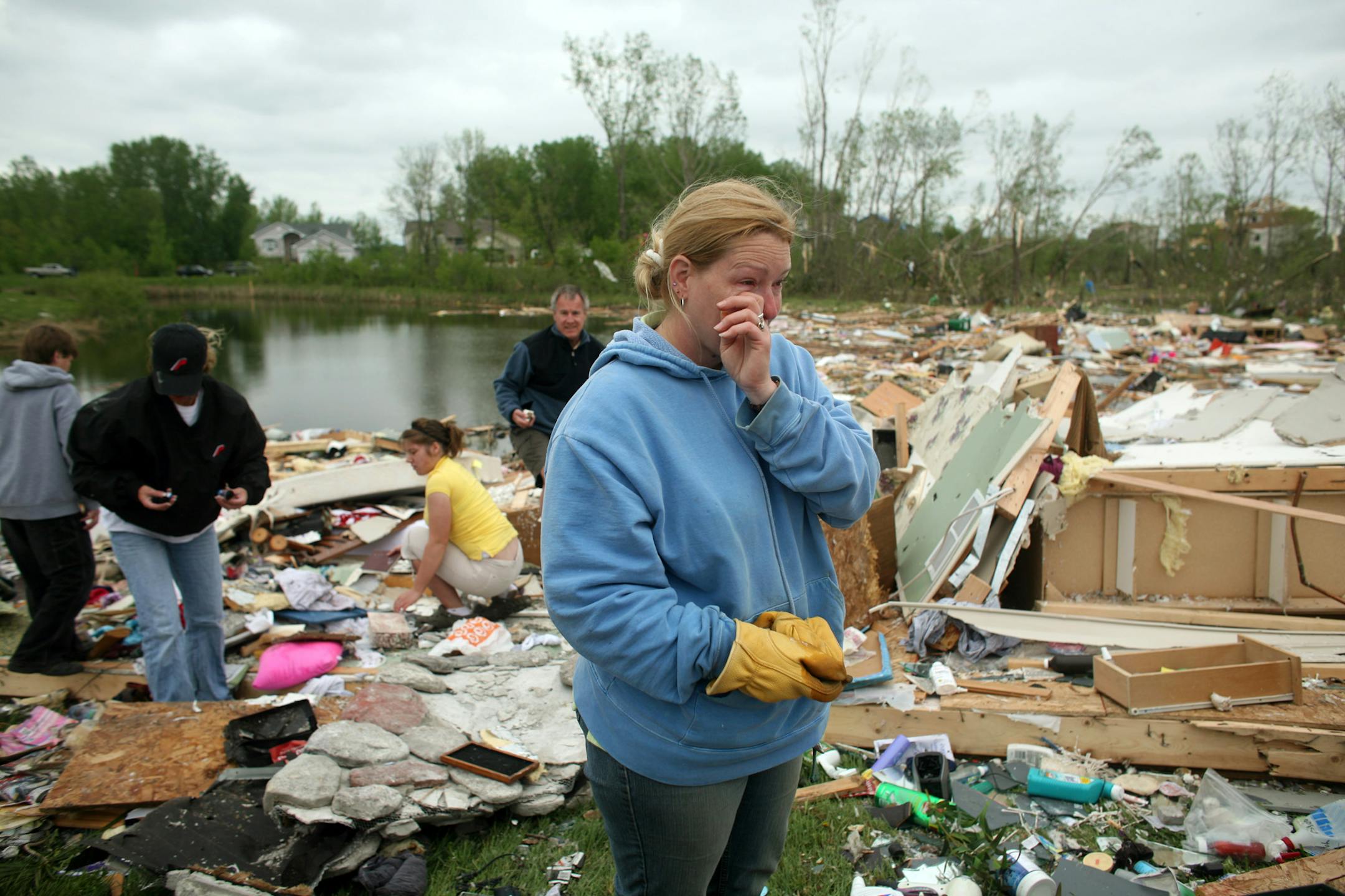 Laura Baldwin-Linders wiped away a tear as she talked about her neighbors who lost their 2-year-old son in the same tornado that completely destroyed her home next door.