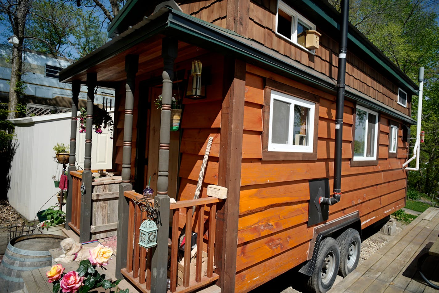 The Kasl family's tiny cottage is clad in siding made of recycled telephone poles.