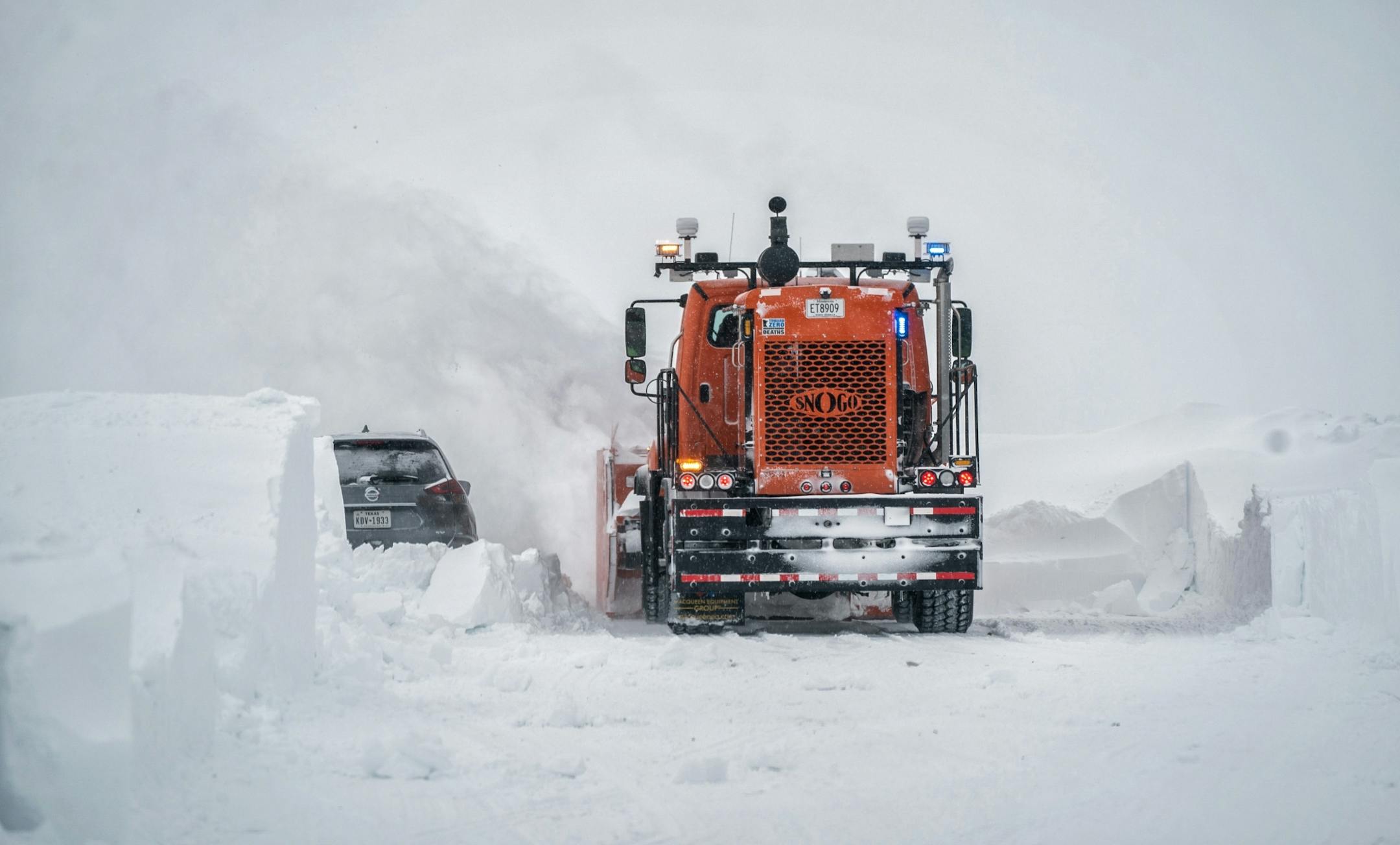 MNDOT crews tried to clear 5 to 8 foot drifts on I-35 south of Owatonna. Abandoned cars and trucks made it tough going.