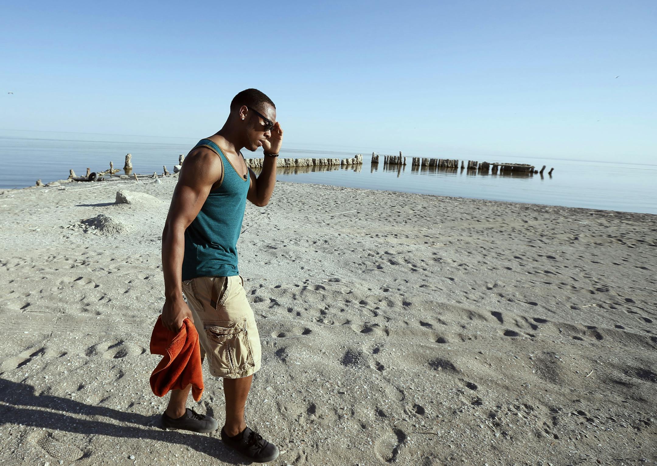 Cedric Thompson walked along the shore of the Salton Sea, in Bombay Beach. Cedric Thompson grew up in Compton. His freshman year at Piedmont High School, three people close to him (a cousin and two friends) were killed in gang shootings. His parents divorced, and his mother urged him to get out of L.A., and move with his dad in Bombay Beach, a forgotten outpost on the Salton Sea. ] JERRY HOLT ‚Ä¢ jerry.holt@startribune.com
