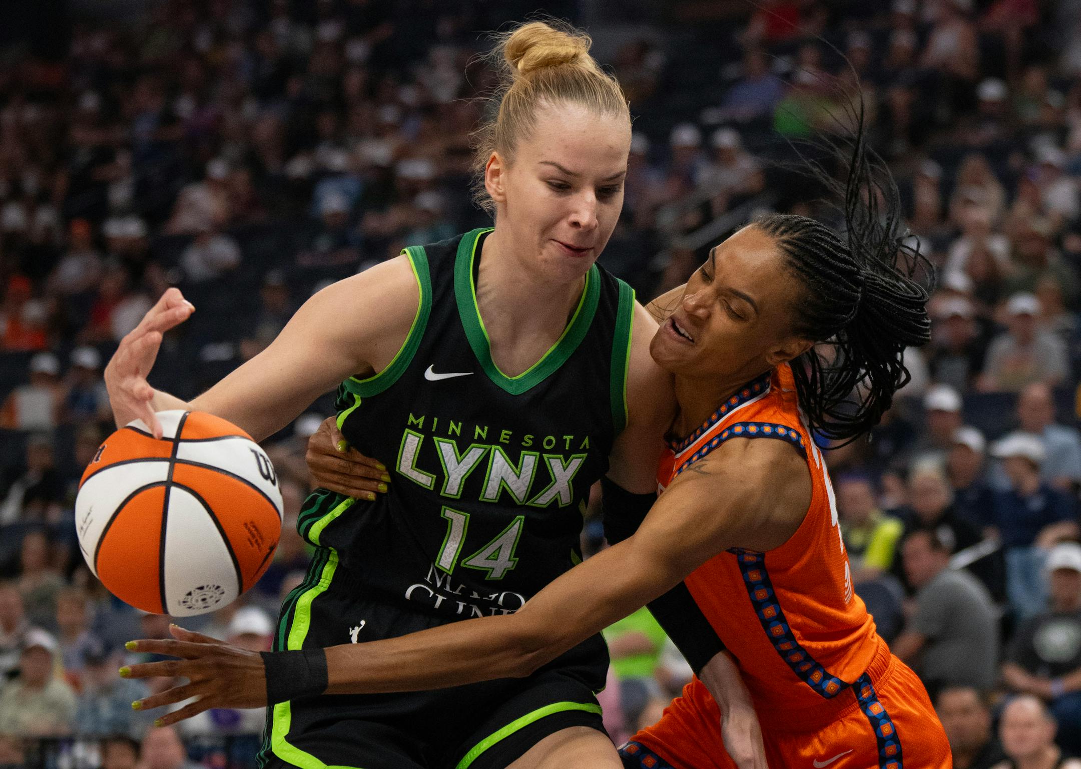 Connecticut Sun forward DeWanna Bonner (24) fouled Minnesota Lynx forward Dorka Juhasz (14) while stripping the ball from her in the first quarter Thursday night. The Minnesota Lynx faced the Connecticut Sun in a WNBA game Thursday night, June 22, 2023 at Target Center in Minneapolis.