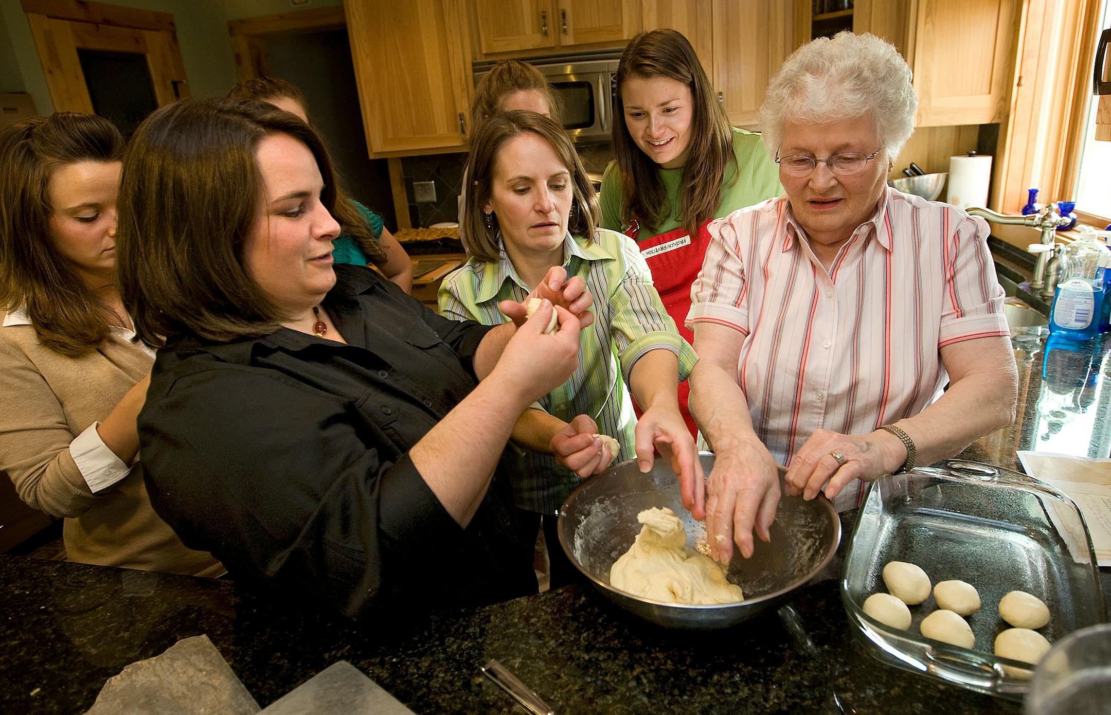 From left: Kelly Pulk, Kris Wishy, Kathy Chase and Jen Edwards got up close to learn how to pinch rolls from Grandma Pulk. Sadie Pulk and Chelsie Huntley stood at the back. "I'm not a teacher," Grandma said. "I just have my own way of doing things."