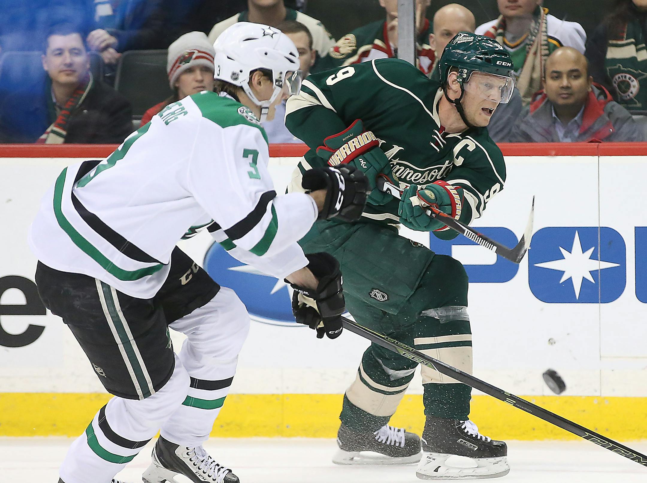 Minnesota Wild center Mikko Koivu centered the puck past Dallas Stars defenseman John Klingberg in the first period. Klingberg scored the game-winner later in overtime.