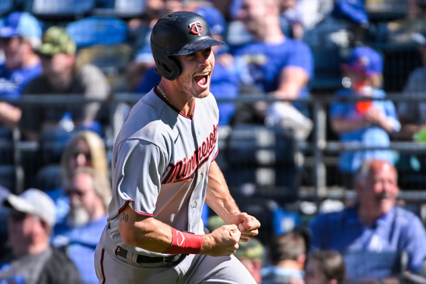 Max Kepler celebrates after scoring the game-winning run in their 7-6 victory over the Kansas City Royals on Sunday