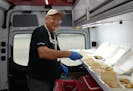 Red Cross volunteer Dave Snetsinger prepared hot meals for those affected by Hurricane Ian in Fort Myers, Fla.
