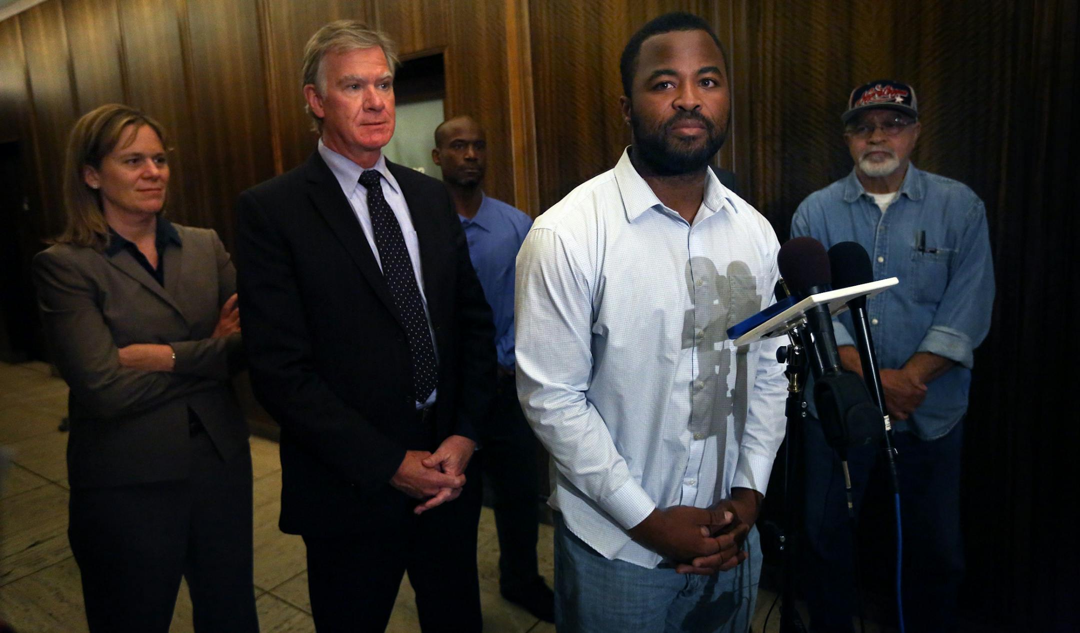 Rashad Turner, the leader of the St. Paul Black Lives Matter group (at mic stand), St. Paul Mayor Chris Coleman (middle) and Saint Paul Deputy Mayor, Kristin Beckmann appeared before members of the media following a meeting Thursday morning at the Mayor�s office.