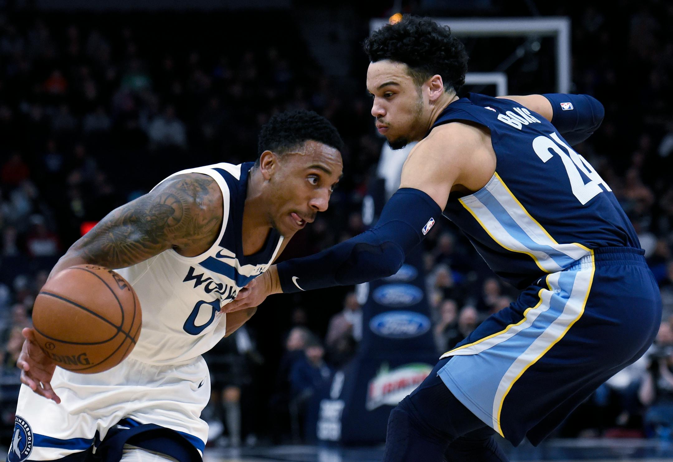 Memphis Grizzlies' Dillon Brooks (24) fouls Minnesota Timberwolves' Jeff Teague (0) during the first quarter of an NBA basketball game on Monday, March 26, 2018, in Minneapolis. (AP Photo/Hannah Foslien)