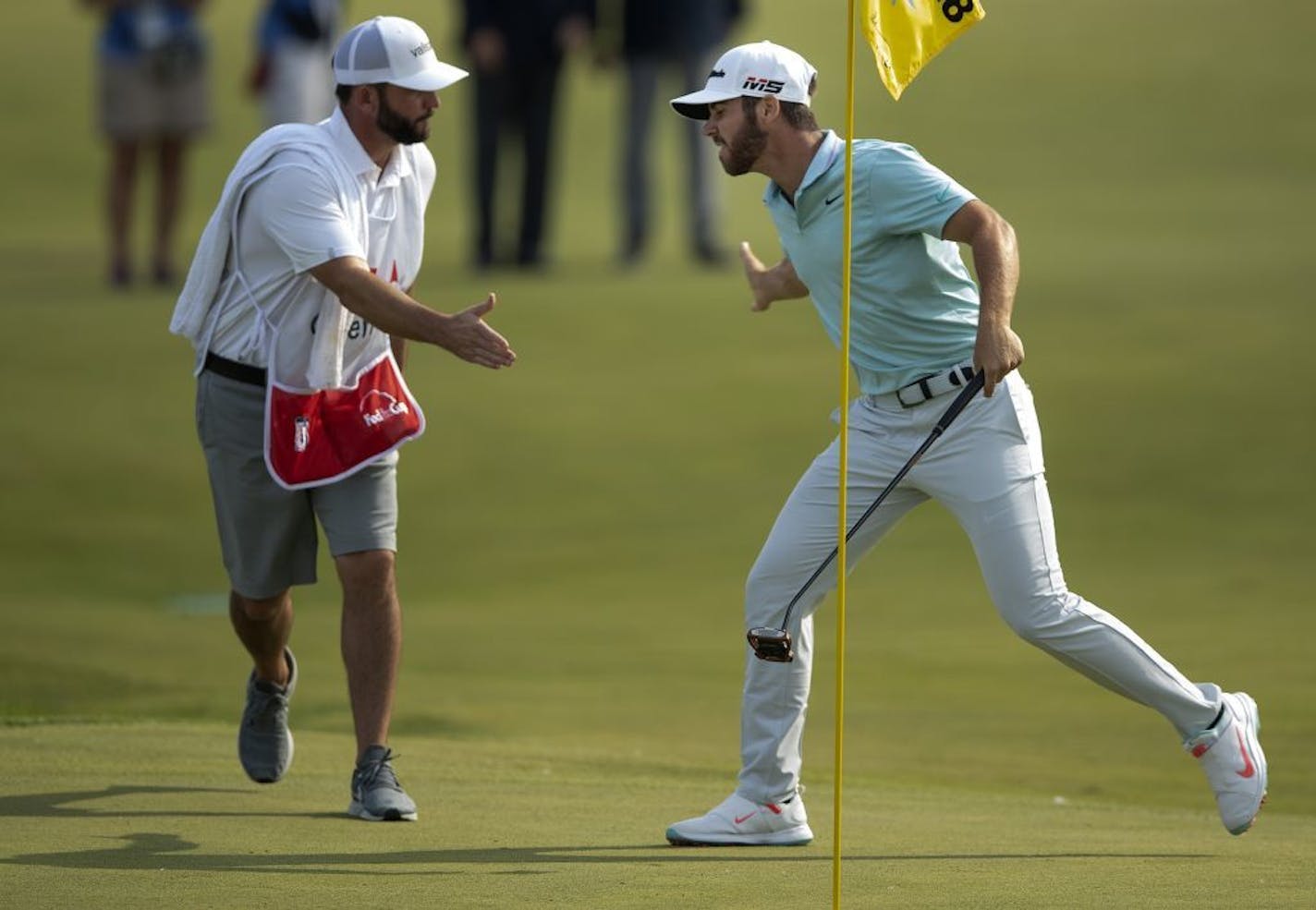 Matthew Wolff right celebrated with his caddy after winning the 3M Open.