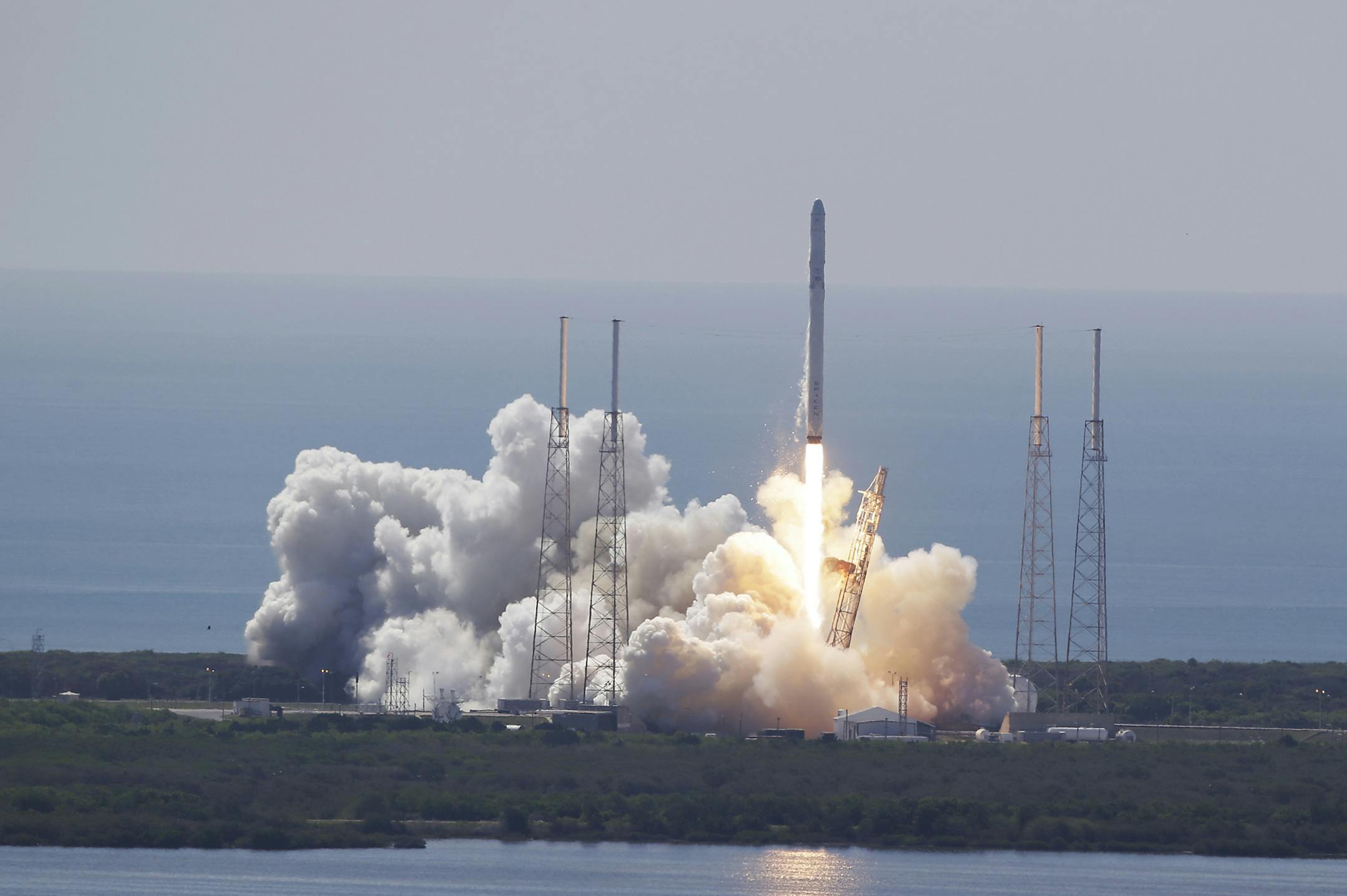 The SpaceX Falcon 9 rocket and Dragon spacecraft lifts off from Space Launch Complex 40 at the Cape Canaveral Air Force Station in Cape Canaveral, Fla., Sunday, June 28, 2015. The rocket carrying supplies to the International Space Station broke apart shortly after liftoff. (AP Photo/John Raoux) ORG XMIT: MIN2015070112484439