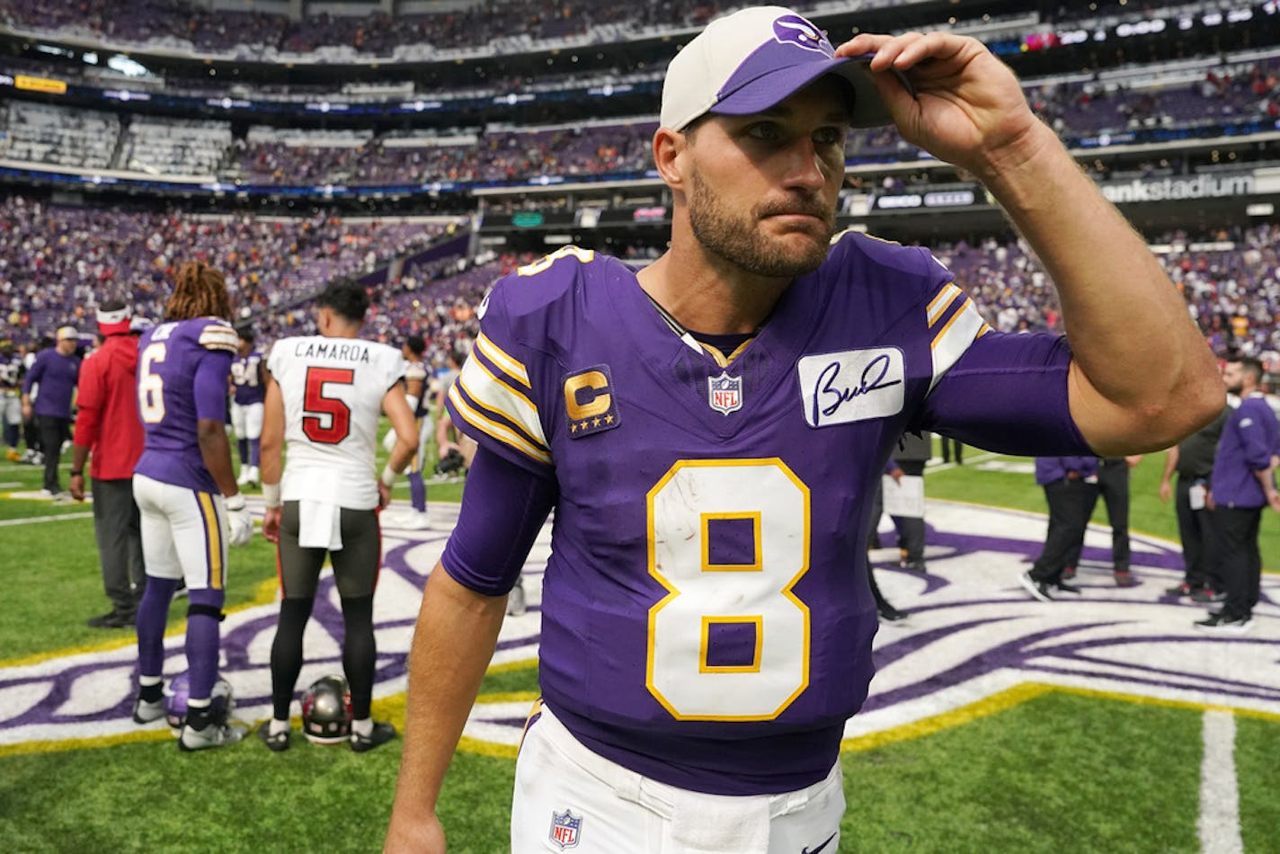 Minnesota Vikings quarterback Kirk Cousins (8) walks off the field after Sunday's loss to Tampa Bay.