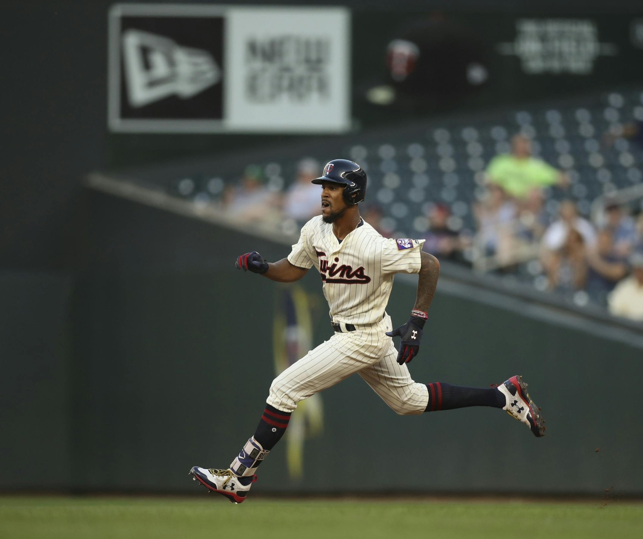 Minnesota Twins center fielder Byron Buxton sprinted to second after his third inning hit to left.