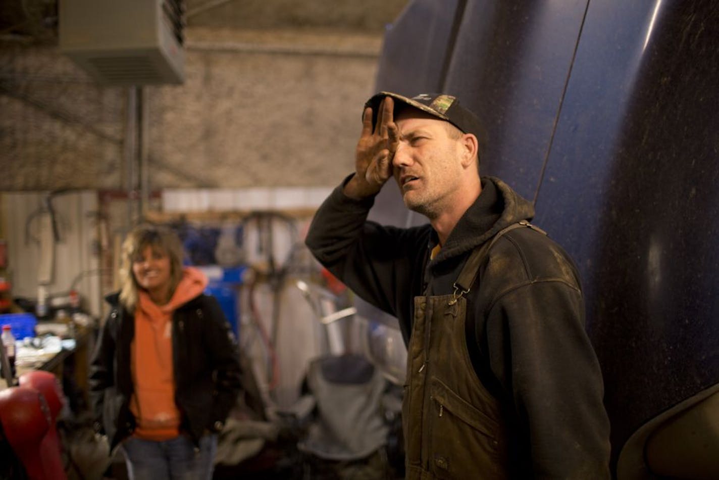 Work in the Bakken Oil Fields of North Dakota has brought an influx of thousands or workers, making North Dakota the fastest growing state in America. In the garage that houses his small trucking comapny, Scott Brevig of Anoka rubbed his eyes while recalling a treacherous winter storm that he drove in since starting his business in Watford, ND. At left was his fiance, Brenda Altenweg.