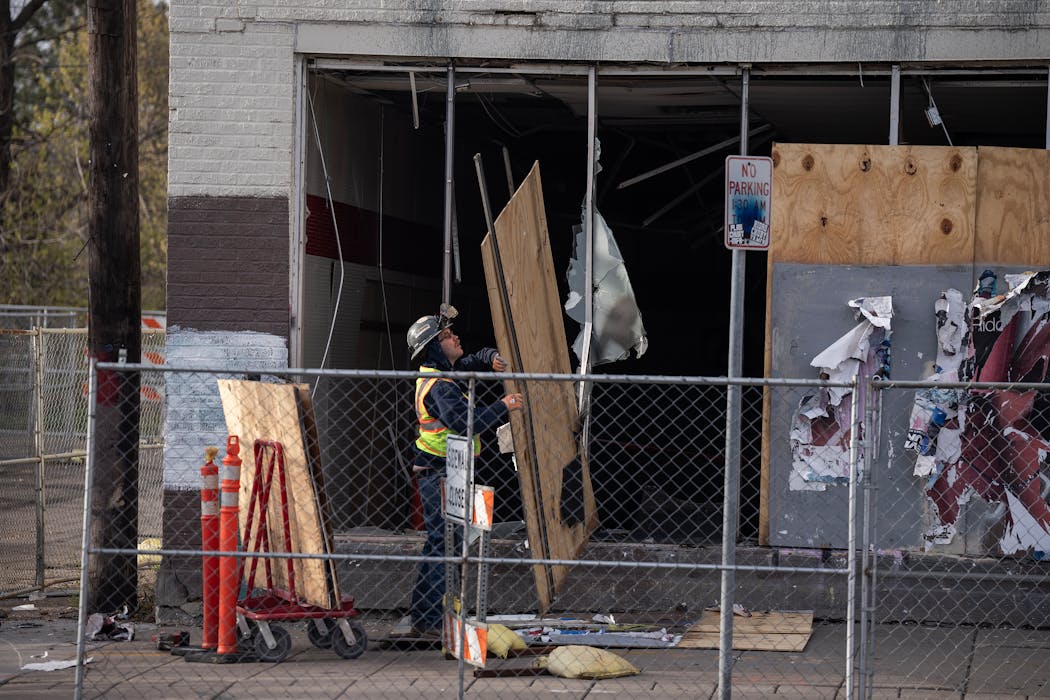 Workers demolish the former O’Reilly Auto Parts store in Minneapolis on April 22.
