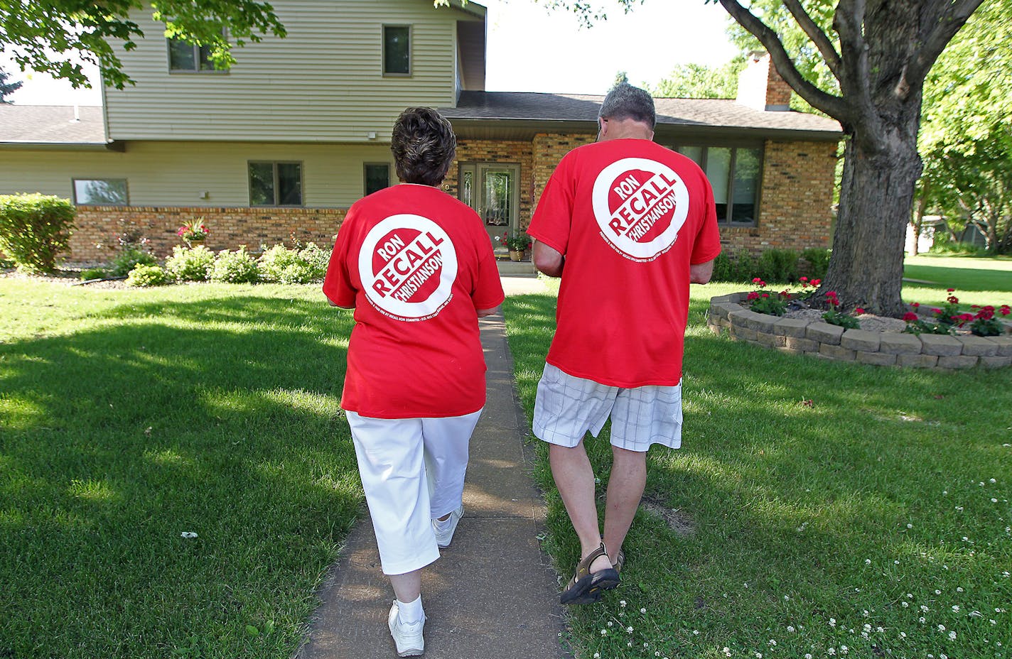 Julie and Brian Asmus took count as they made their way around a neighborhood to collect recall signatures, Tuesday, June 23, 2015 in Wilma, MN. They are part of a group that has begun a campaign to recall Ron Christianson, the longest-serving council member. ] (ELIZABETH FLORES/STAR TRIBUNE) ELIZABETH FLORES &#x2022; eflores@startribune.com