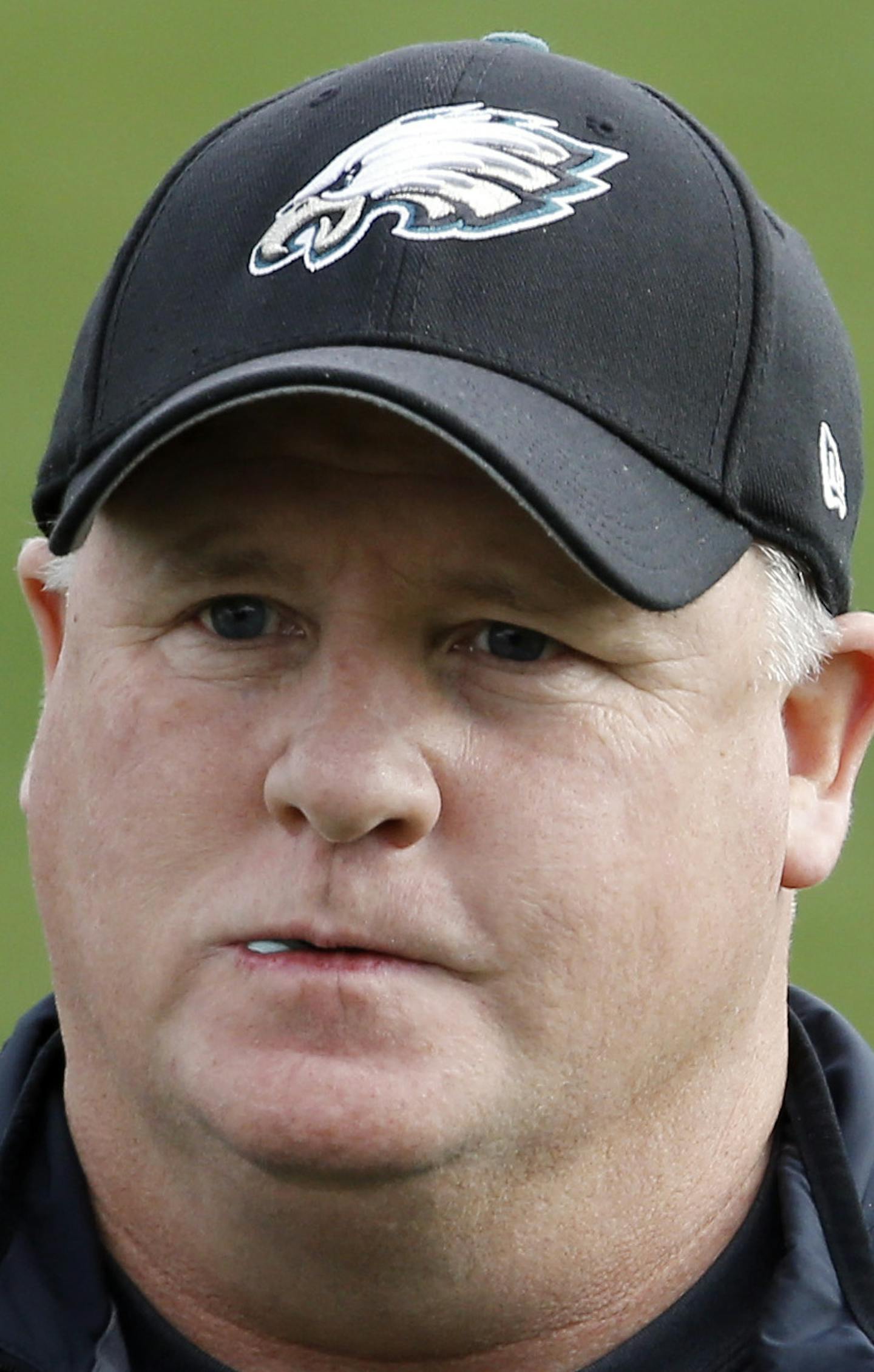 Philadelphia Eagles head coach Chip Kelly catches a pass at the NFL football team's practice facility, Tuesday, Dec. 15, 2015, in Philadelphia. (AP Photo/Matt Rourke) ORG XMIT: PAMR102