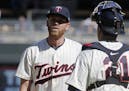 Minnesota Twins relief pitcher Michael Tonkin, left, gets a visit on the mount from catcher Jason Castro in the ninth inning of a baseball game Saturd