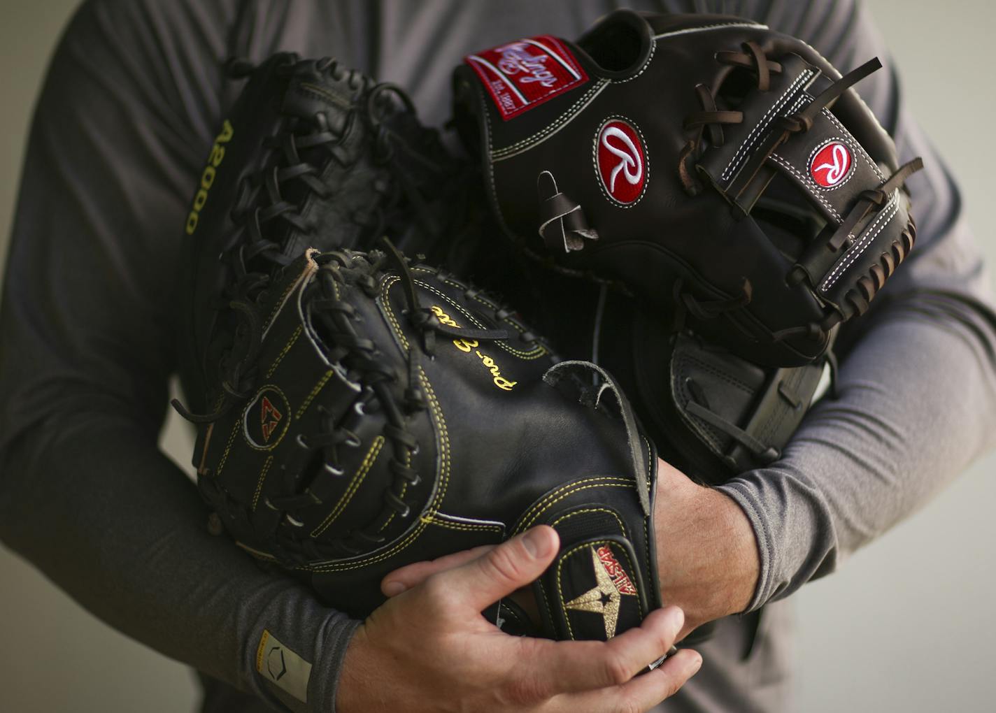 Twins catcher Chris Herrmann with all his gloves Wednesday afternoon at Hammond Stadium in Fort Myers. ] JEFF WHEELER &#xef; jeff.wheeler@startribune.com The Twins played their first exhibition baseball game against the University of Minnesota team Wednesday night, March 4, 2015, at Hammond Stadium in Fort Myers, FL.