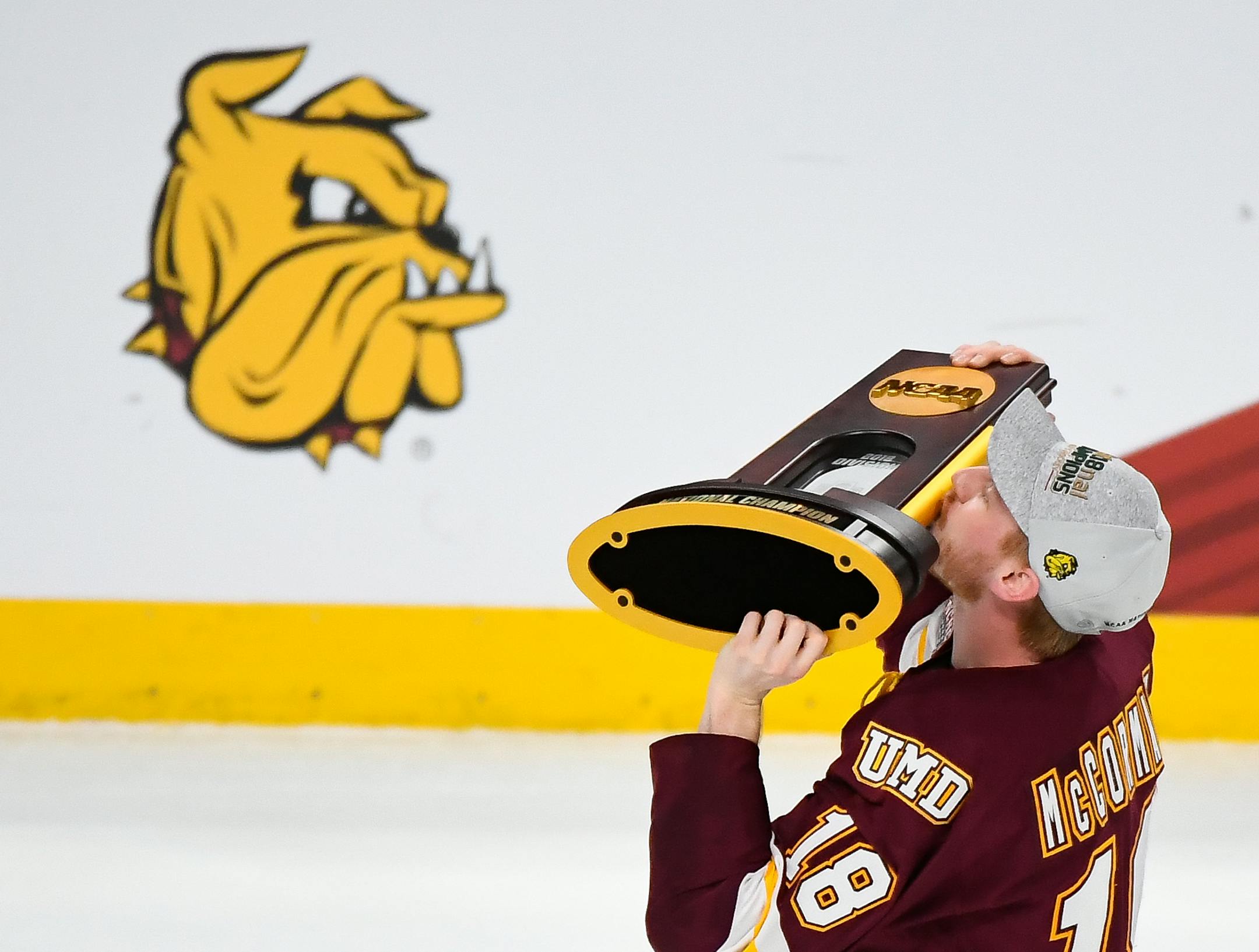 Minnesota-Duluth Bulldogs defenseman Nick McCormack (18) kissed the NCAA championship trophy while celebrating with teammates following their team's 2-1 victory over Notre Dame Fighting Irish in the national title game. ] AARON LAVINSKY ï aaron.lavinsky@startribune.com The University of Minnesota-Duluth Bulldogs played the Notre Dame Fighting Irish in the NCAA Championship men's hockey game on Friday, April 6, 2018 at Xcel Energy Center in St. Paul, Minn.