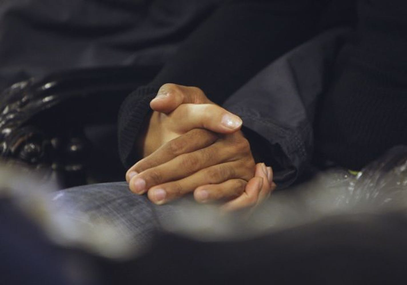 A couple holds hands during a mass in honor of the victims of Air France flight 447, which was reported missing on its way from Rio de Janeiro to Paris, at a church in Rio de Janeiro, Thursday, June 4, 2009. Air France has told families of passengers on Sunday's flight that the jetliner broke apart and they must abandon hope that anyone survived, a grief counselor said Thursday as Brazilian ships neared debris bobbing in the Atlantic.