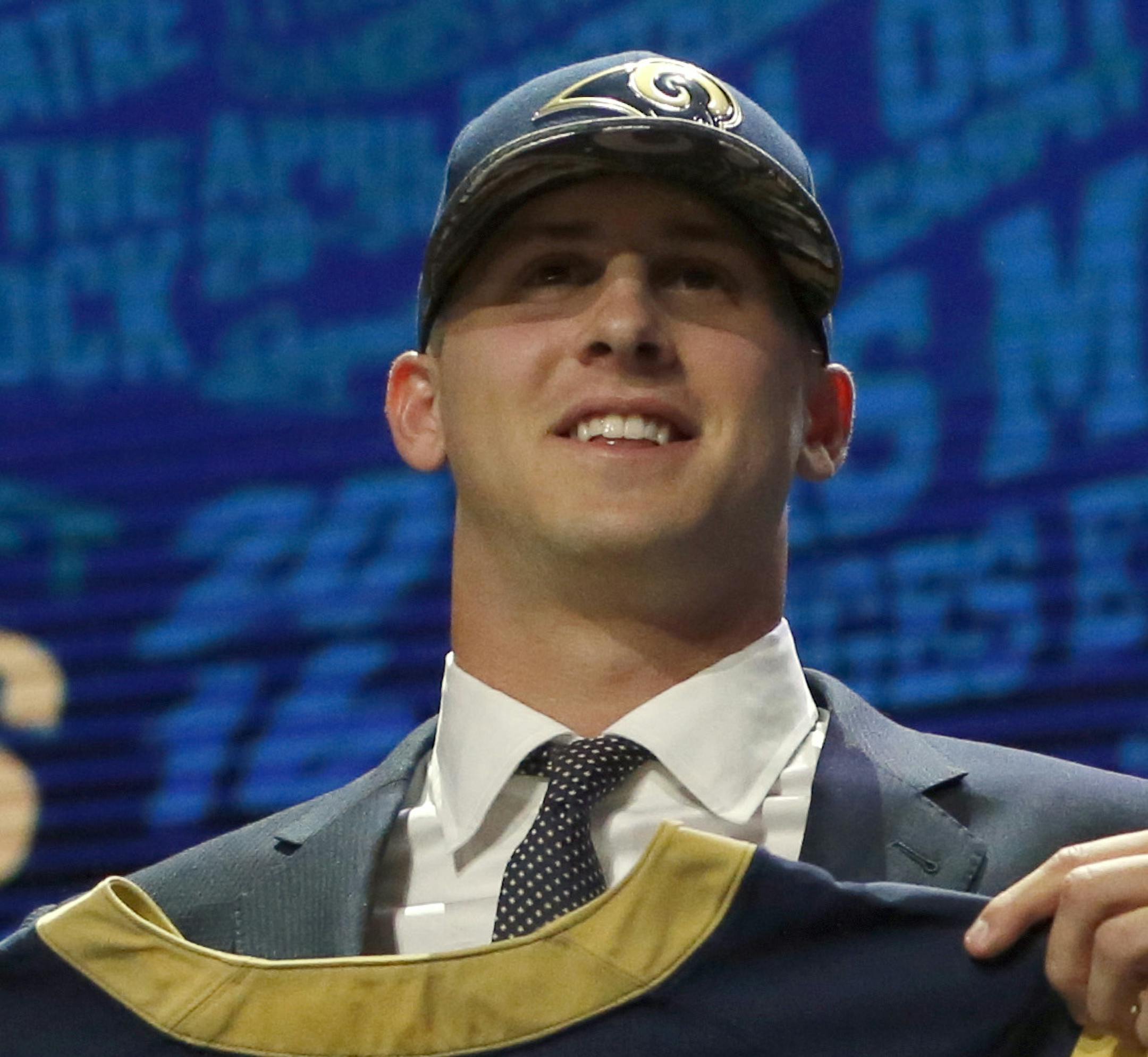 Californiaís Jared Goff poses for photos after being selected by the Los Angeles Rams as the first pick in the first round of the 2016 NFL football draft, Thursday, April 28, 2016, in Chicago. (AP Photo/Charles Rex Arbogast) ORG XMIT: ILKS149