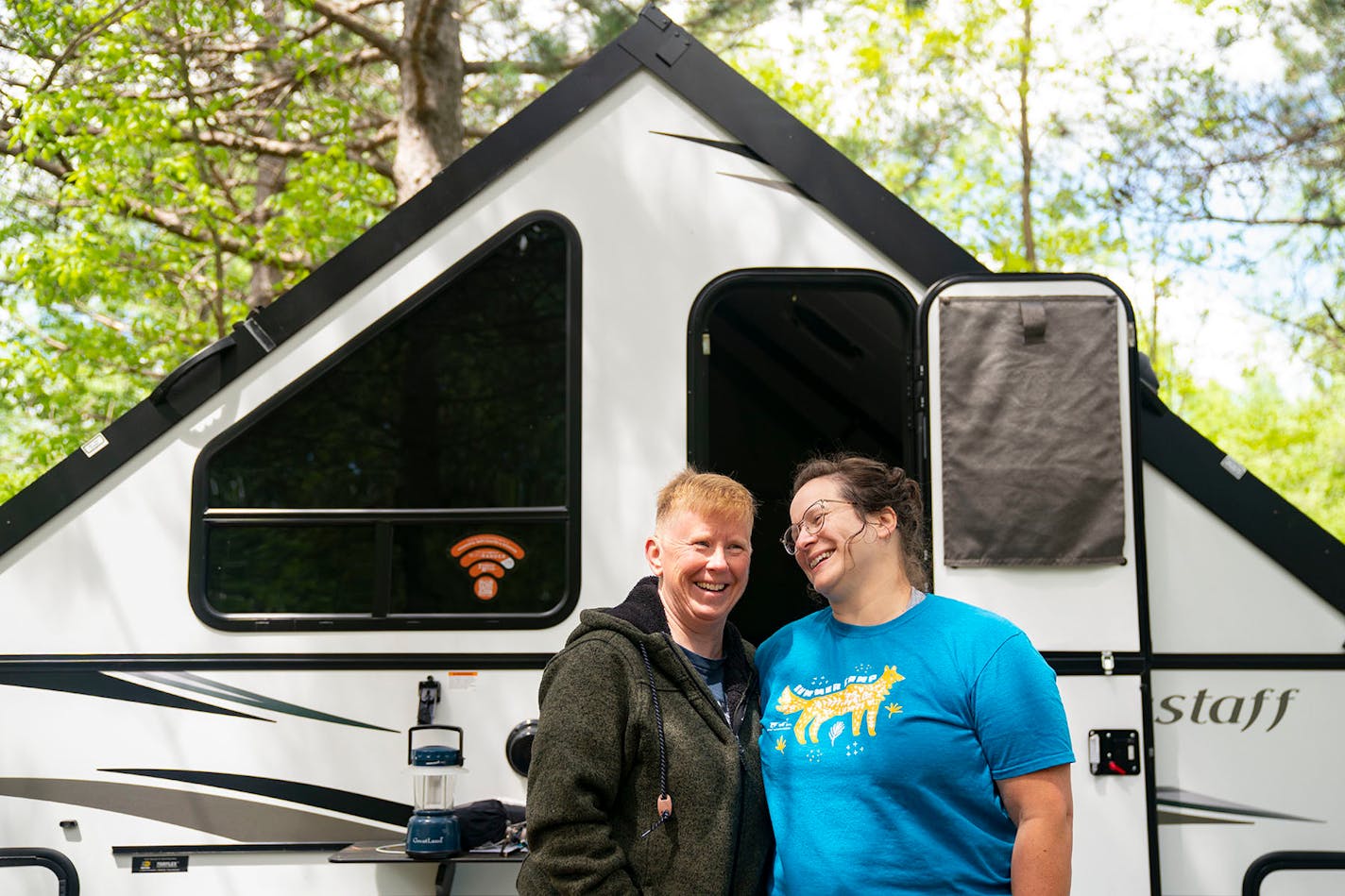 Wendy, left, and Holly Watson-Wetzel used some of their stimulus money to buy an A-frame camper. They are shown at Moose Lake State Park.